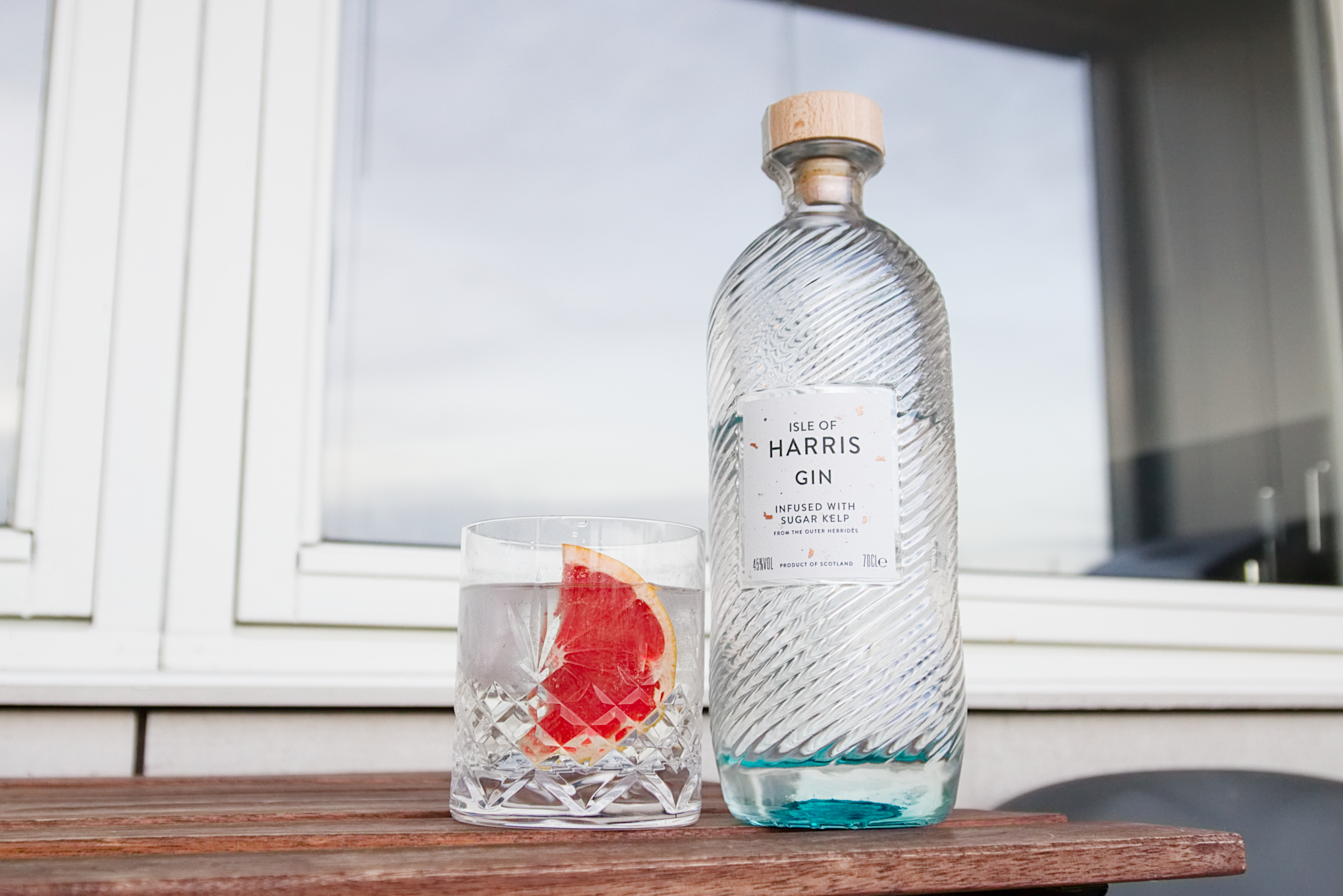 Picture of Isle of Harris Gin with a Gin and Tonic next to it